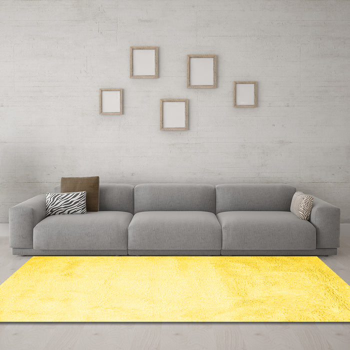 Machine Washable Solid Yellow Modern Rug in a Living Room, wshcon651yw