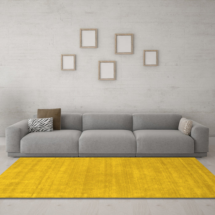 Machine Washable Solid Yellow Modern Rug in a Living Room, wshcon65yw