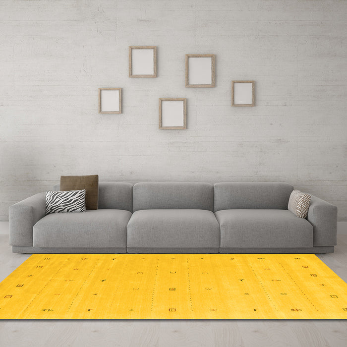 Machine Washable Solid Yellow Modern Rug in a Living Room, wshcon662yw