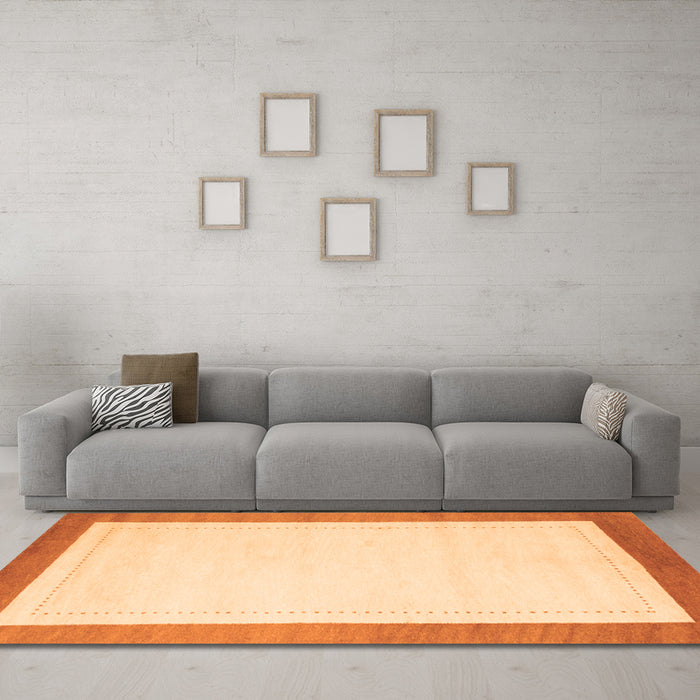 Machine Washable Solid Orange Modern Area Rugs in a Living Room, wshcon664org