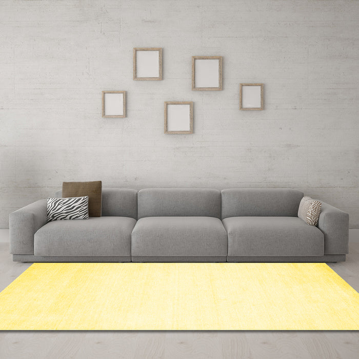 Machine Washable Solid Yellow Modern Rug in a Living Room, wshcon68yw