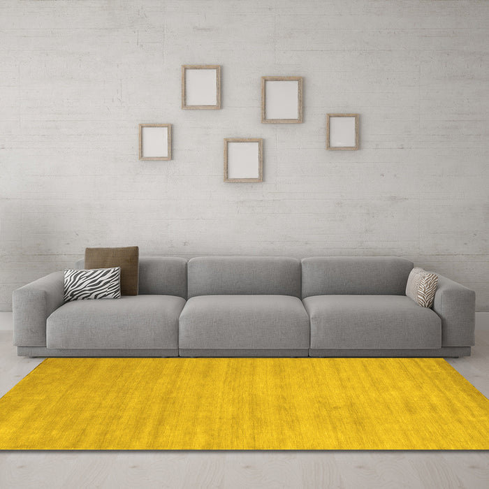 Machine Washable Solid Yellow Modern Rug in a Living Room, wshcon70yw