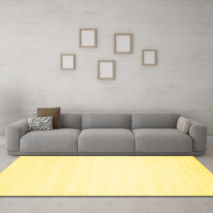 Machine Washable Solid Yellow Modern Rug in a Living Room, wshcon75yw
