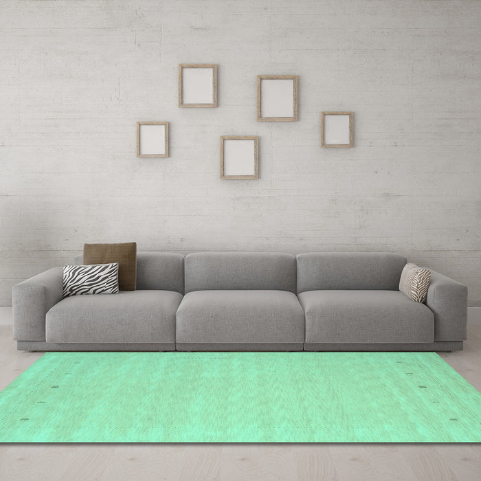 Machine Washable Solid Turquoise Modern Area Rugs in a Living Room,, wshcon790turq