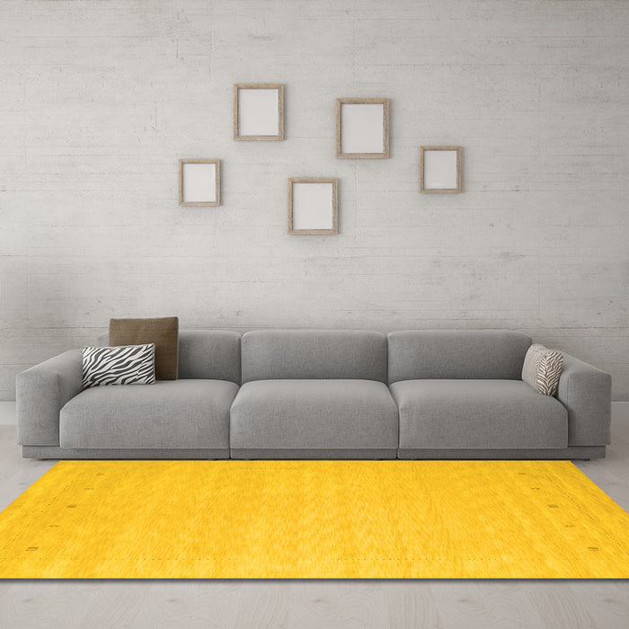 Machine Washable Solid Yellow Modern Rug in a Living Room, wshcon790yw