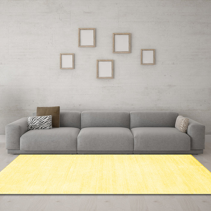 Machine Washable Solid Yellow Modern Rug in a Living Room, wshcon81yw