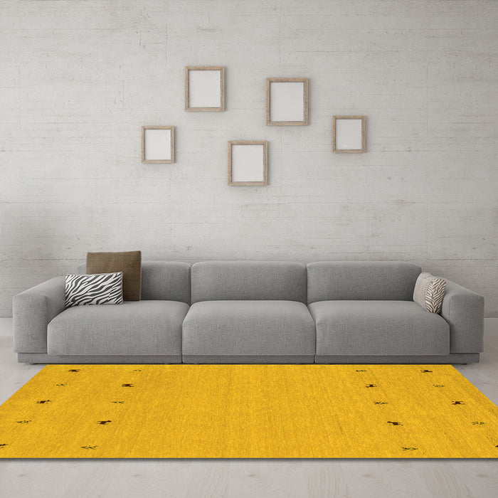 Machine Washable Solid Yellow Modern Rug in a Living Room, wshcon884yw