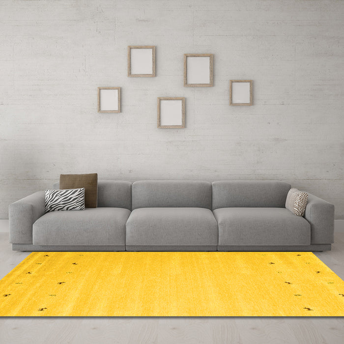 Machine Washable Solid Yellow Modern Rug in a Living Room, wshcon893yw