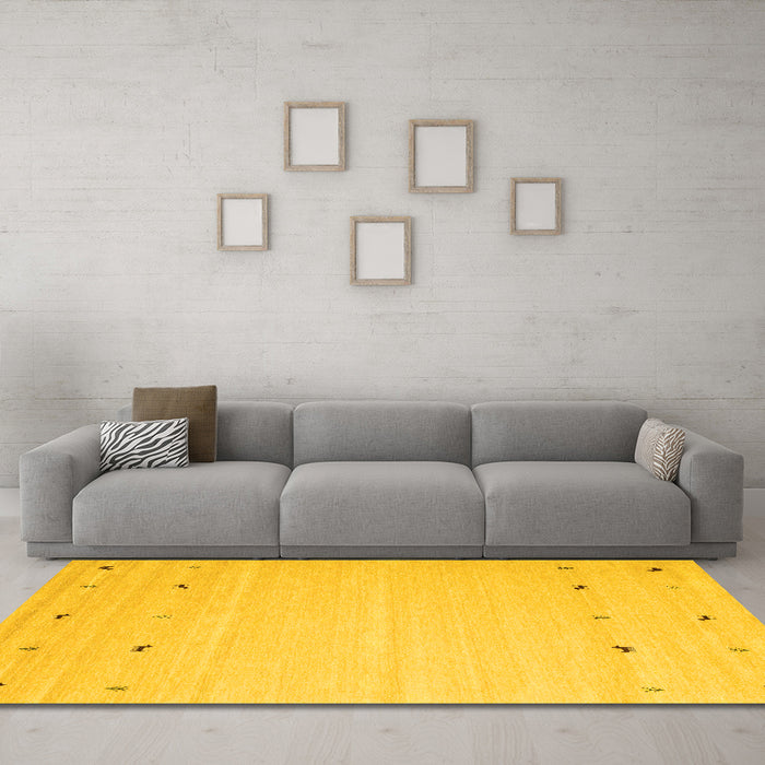 Machine Washable Solid Yellow Modern Rug in a Living Room, wshcon910yw