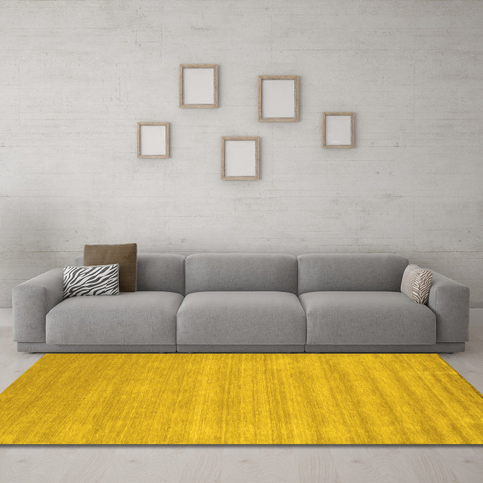 Machine Washable Solid Yellow Modern Rug in a Living Room, wshcon99yw