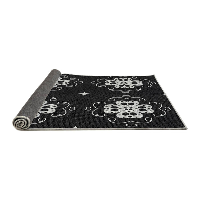 Thickness of Patterned Black Novelty Rug, pat2222