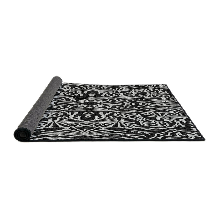 Thickness of Patterned Black Novelty Rug, pat2623