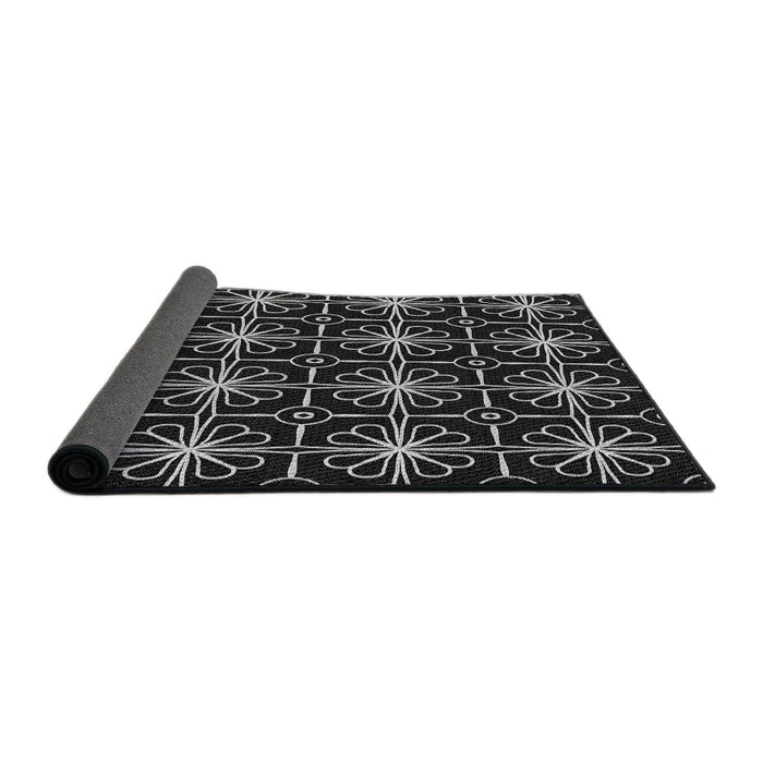 Thickness of Patterned Black Novelty Rug, pat2985
