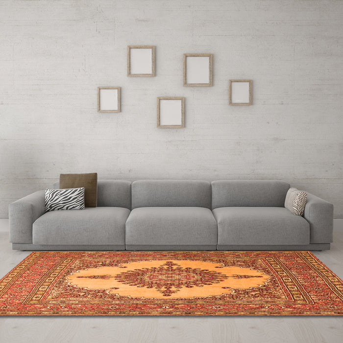 Machine Washable Medallion Orange Traditional Area Rugs in a Living Room, wshtr1601org