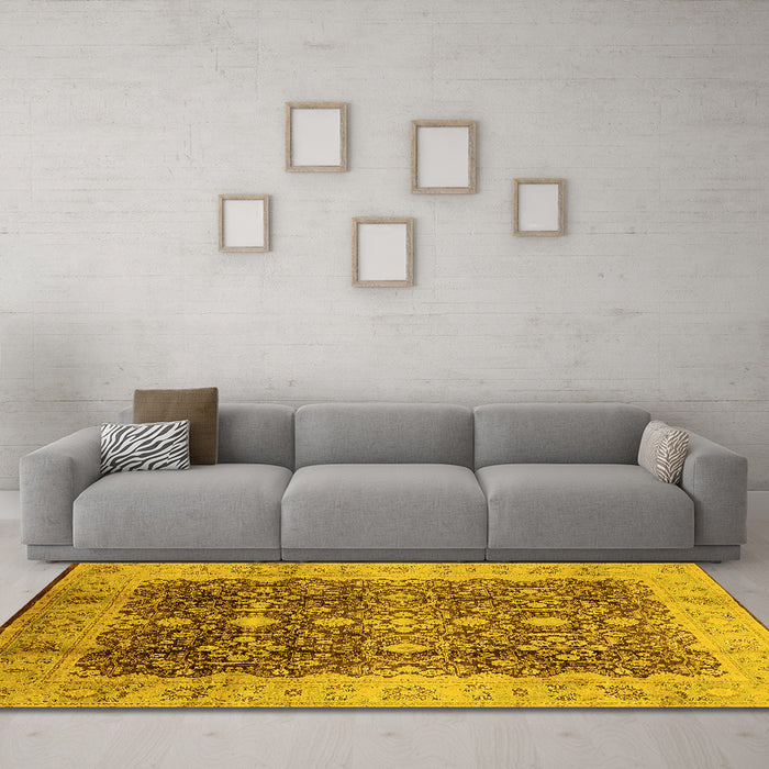 Machine Washable Oriental Yellow Traditional Rug in a Living Room, wshurb1062yw