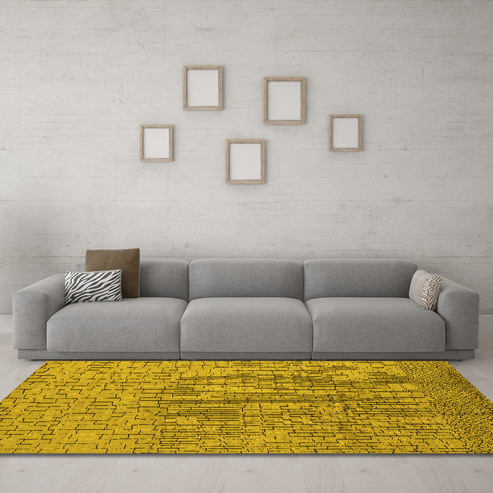 Machine Washable Solid Yellow Modern Rug in a Living Room, wshurb1174yw