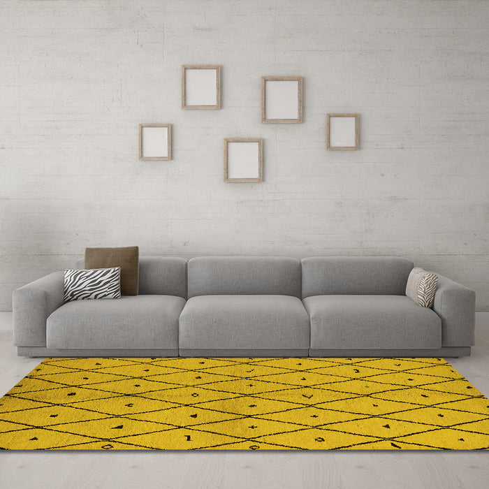 Machine Washable Solid Yellow Modern Rug in a Living Room, wshurb1210yw