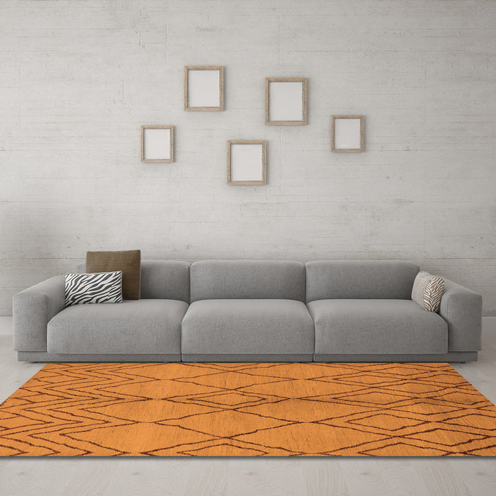 Machine Washable Solid Orange Modern Area Rugs in a Living Room, wshurb1211org