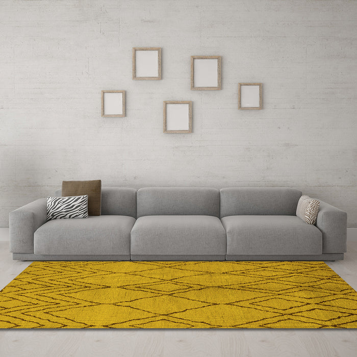 Machine Washable Solid Yellow Modern Rug in a Living Room, wshurb1211yw