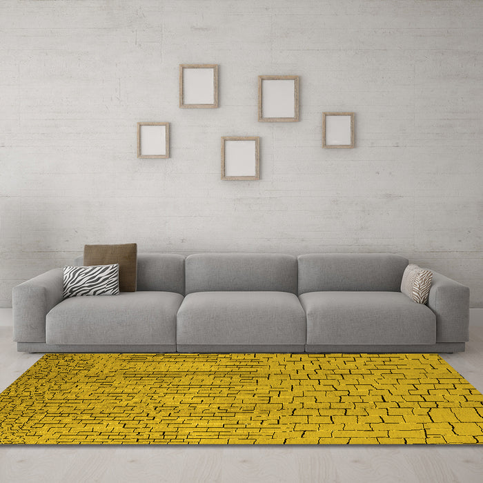 Machine Washable Solid Yellow Modern Rug in a Living Room, wshurb1213yw