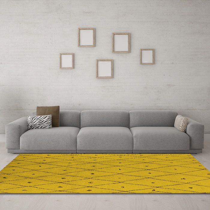 Machine Washable Solid Yellow Modern Rug in a Living Room, wshurb1214yw