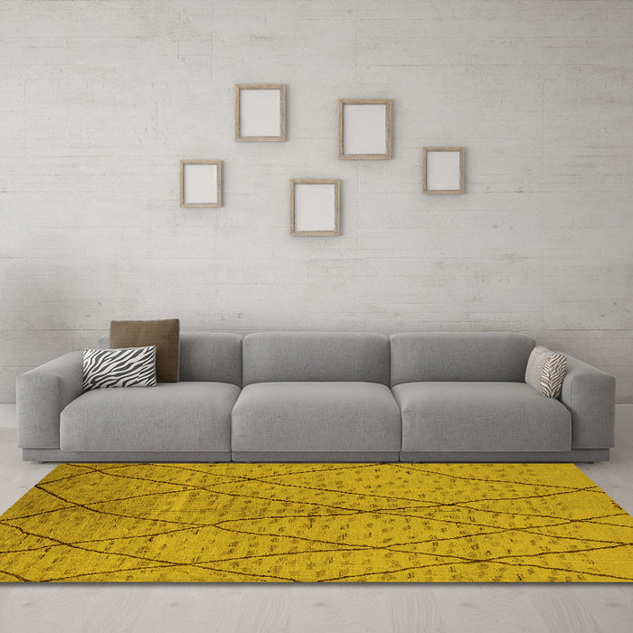 Machine Washable Solid Yellow Modern Rug in a Living Room, wshurb1216yw