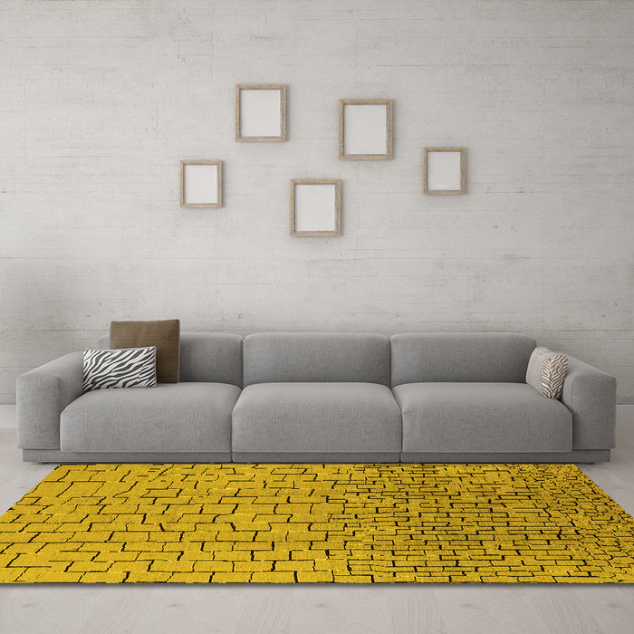 Machine Washable Solid Yellow Modern Rug in a Living Room, wshurb1240yw