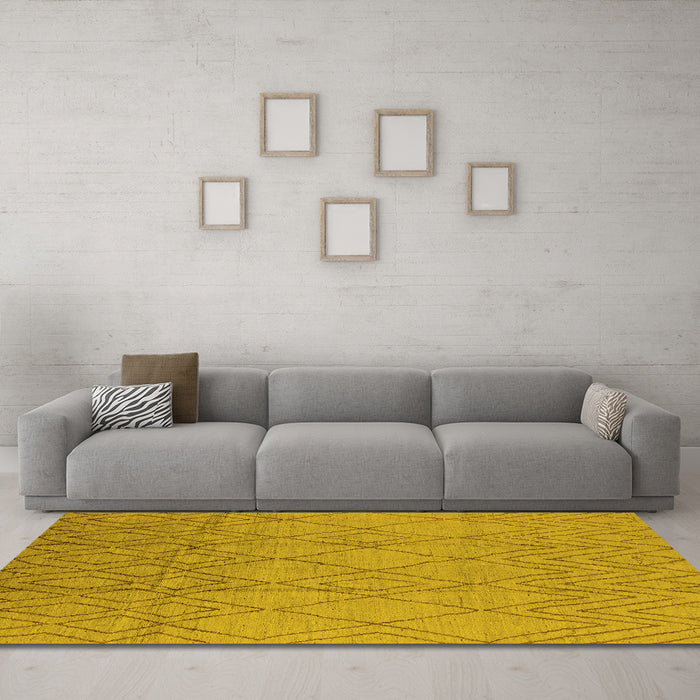 Machine Washable Solid Yellow Modern Rug in a Living Room, wshurb1249yw