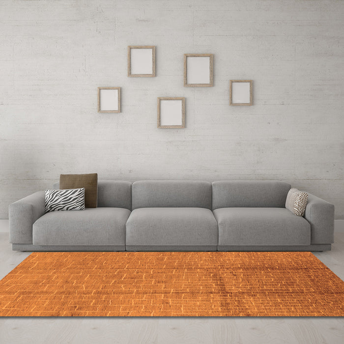Machine Washable Solid Orange Modern Area Rugs in a Living Room, wshurb1251org