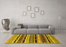 Machine Washable Solid Yellow Modern Rug in a Living Room, wshurb1275yw