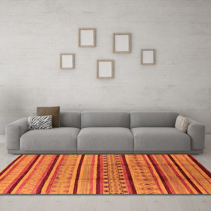 Machine Washable Solid Orange Modern Area Rugs in a Living Room, wshurb1276org