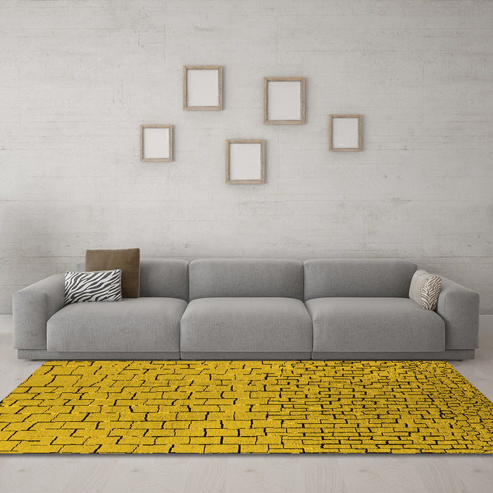Machine Washable Solid Yellow Modern Rug in a Living Room, wshurb1283yw