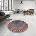 Round Mid-Century Modern Saffron Red Oriental Rug in a Office, urb2013