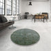 Round Mid-Century Modern Dark Olive Green Oriental Rug in a Office, urb2434