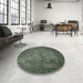 Round Mid-Century Modern Camouflage Green Oriental Rug in a Office, urb2900