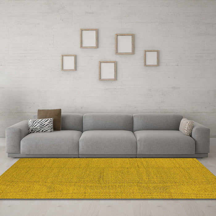 Machine Washable Solid Yellow Modern Rug in a Living Room, wshurb2948yw