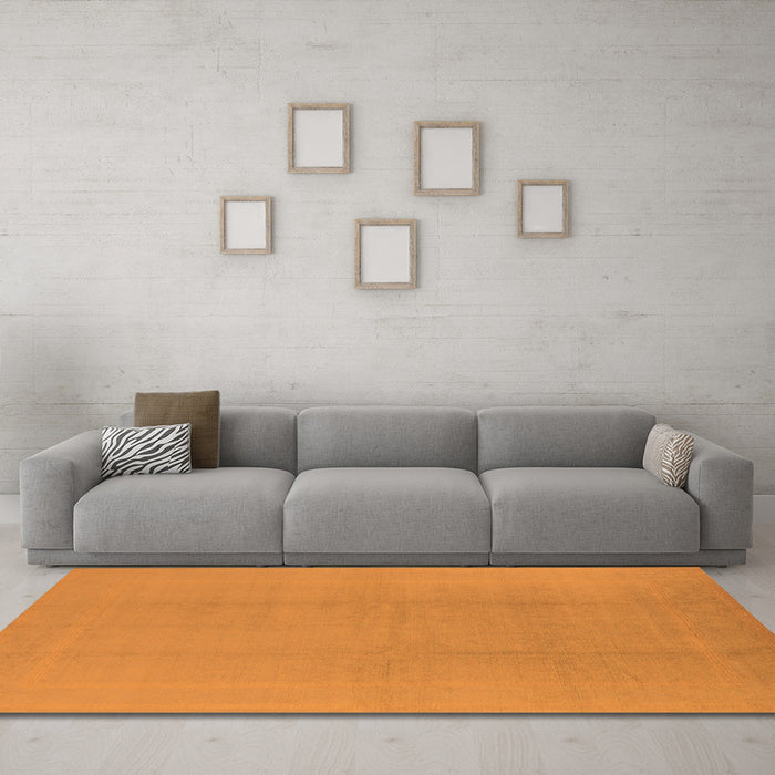 Machine Washable Solid Orange Modern Area Rugs in a Living Room, wshurb502org
