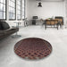 Round Mid-Century Modern Dark Scarlet Red Oriental Rug in a Office, urb926