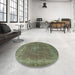 Round Mid-Century Modern Dark Olive Green Oriental Rug in a Office, urb953