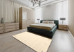 Contemporary Golden Blonde Gold Solid Rug in a Bedroom, con152