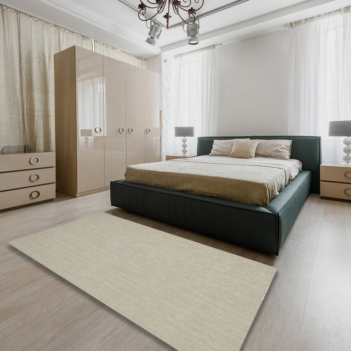 Contemporary Tan Brown Solid Rug in a Bedroom, con204