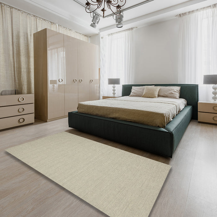 Contemporary Tan Brown Solid Rug in a Bedroom, con220