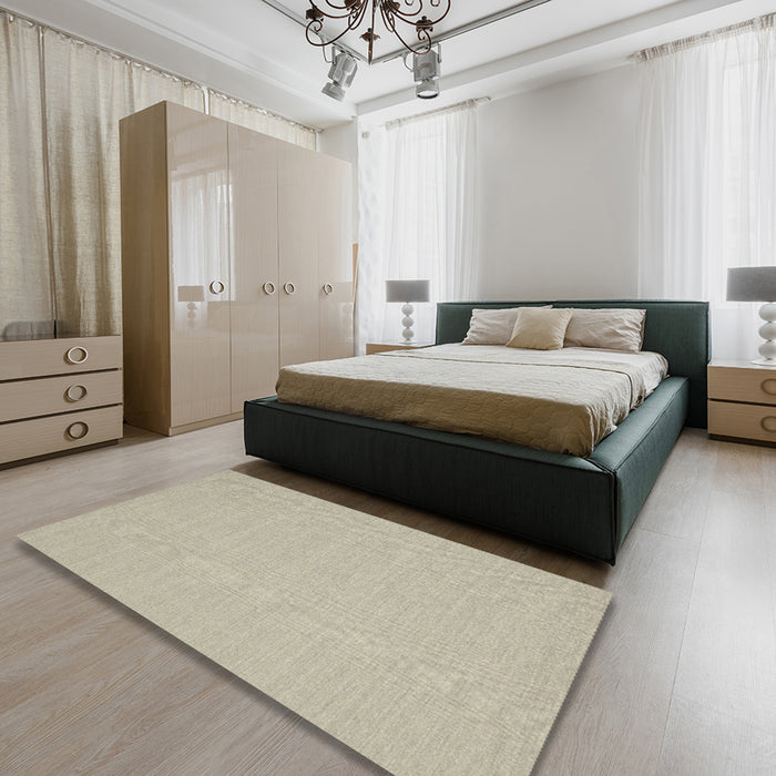 Contemporary Tan Brown Solid Rug in a Bedroom, con225