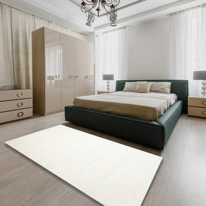 Contemporary Beige Solid Rug in a Bedroom, con414