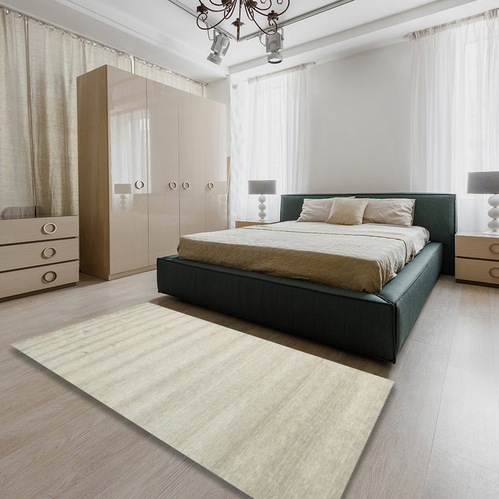 Contemporary Tan Brown Solid Rug in a Bedroom, con590