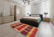 Patterned Red Rug in a Bedroom, pat13org