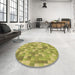 Round Patterned Dark Yellow Green Rug in a Office, pat2059brn