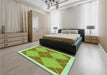 Patterned Dark Yellow Green Rug in a Bedroom, pat243grn