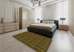 Patterned Dark Yellow Green Rug in a Bedroom, pat26org