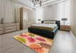 Patterned Yellow Orange Rug in a Bedroom, pat289org